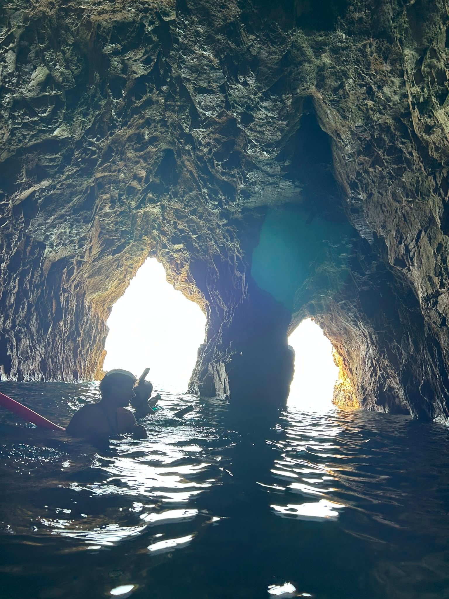 View from inside the grotto out through both natural exits